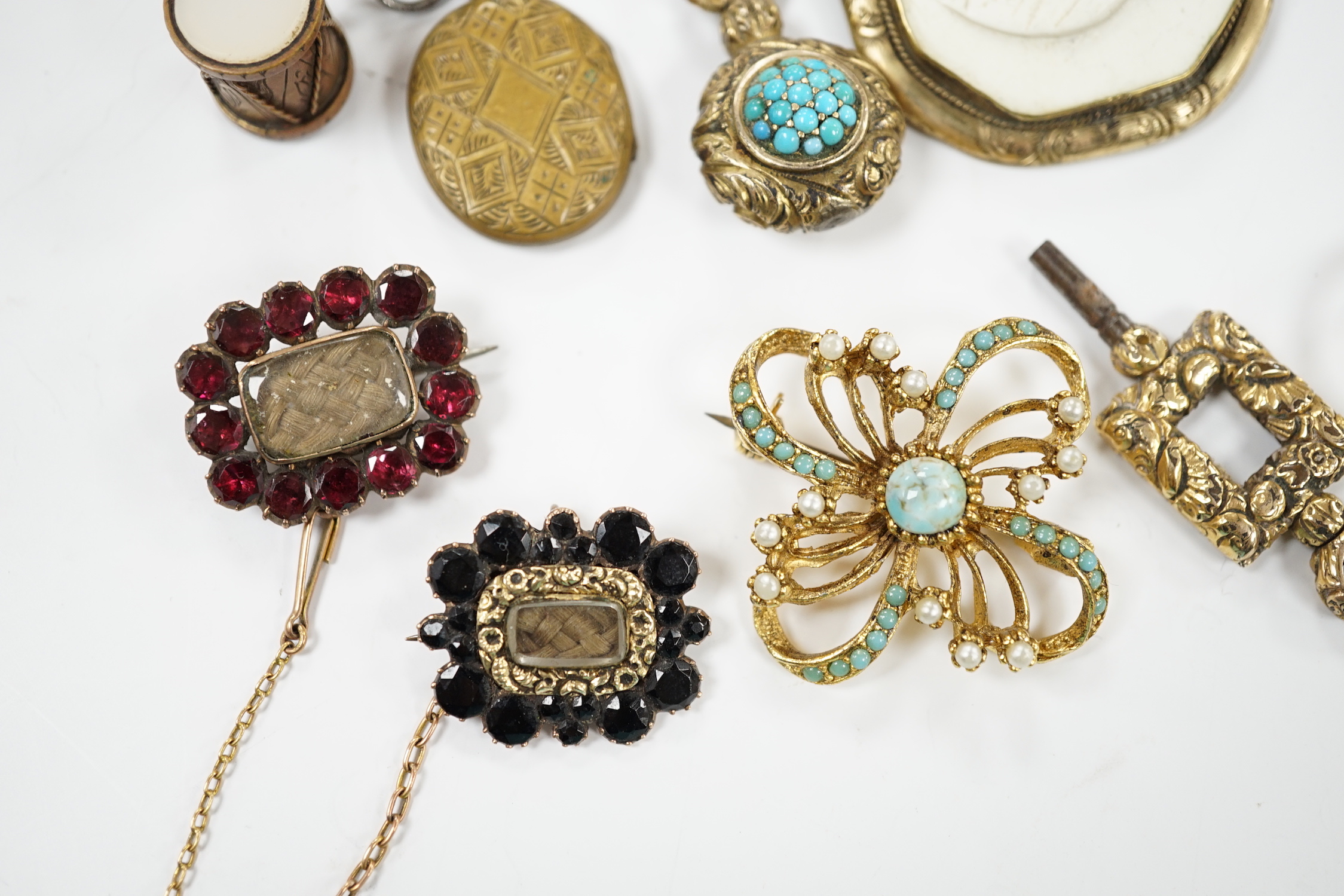 Two Georgian yellow metal mourning brooches, including garnet set and other items including garnet set brooch, watch key, eye glass, paste brooch, etc.